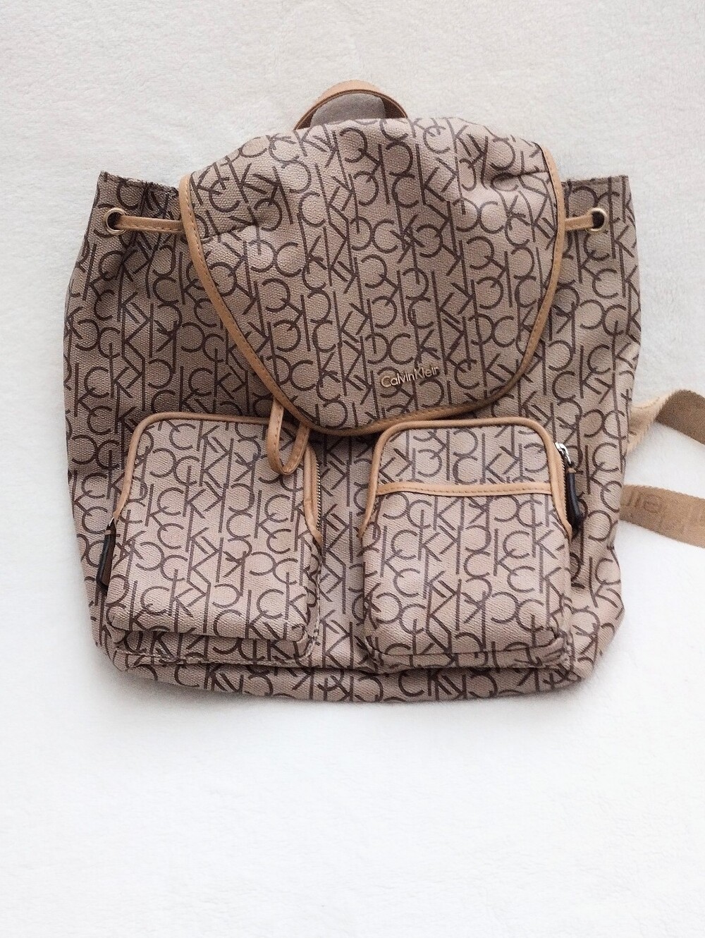 Calvin Klein Monogram Drawstring Backpack in Beige and Brown